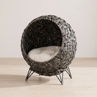 Aurelia elevated rattan cat bed three quarter view showing weave, cushion and metal legs
