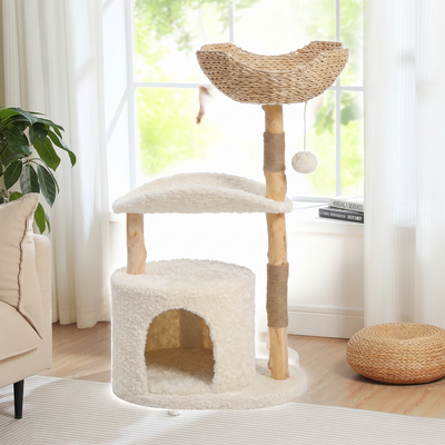 Basken modern cat tree with solid wood posts and wicker basket on a white background