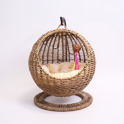 Nidra semi enclosed rattan hanging cat hammock basket on a white background