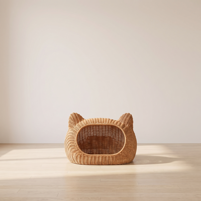 Verano rattan cat villa in a minimal room against a warm off-white wall